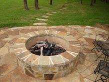 Outdoor fire pit build by Clean Green, inc.