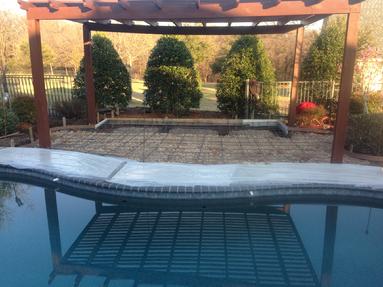Outdoor leaving with wood fireplace and drop in grill