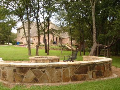 The fire pit and outdoor sitting area shown above ties two elements together.