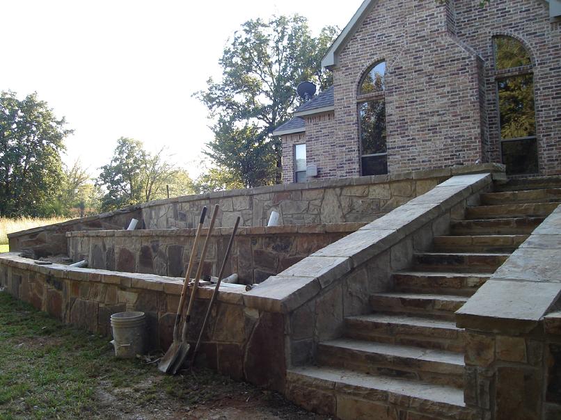 Stone work walls, steps, planters, beds and drainage by Clean Green